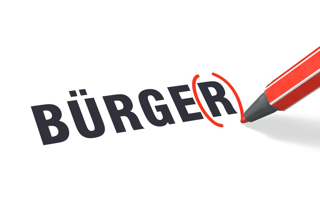 Schriftzug Bürger. Das hintere R wird mit einem Stift rot umklammert.